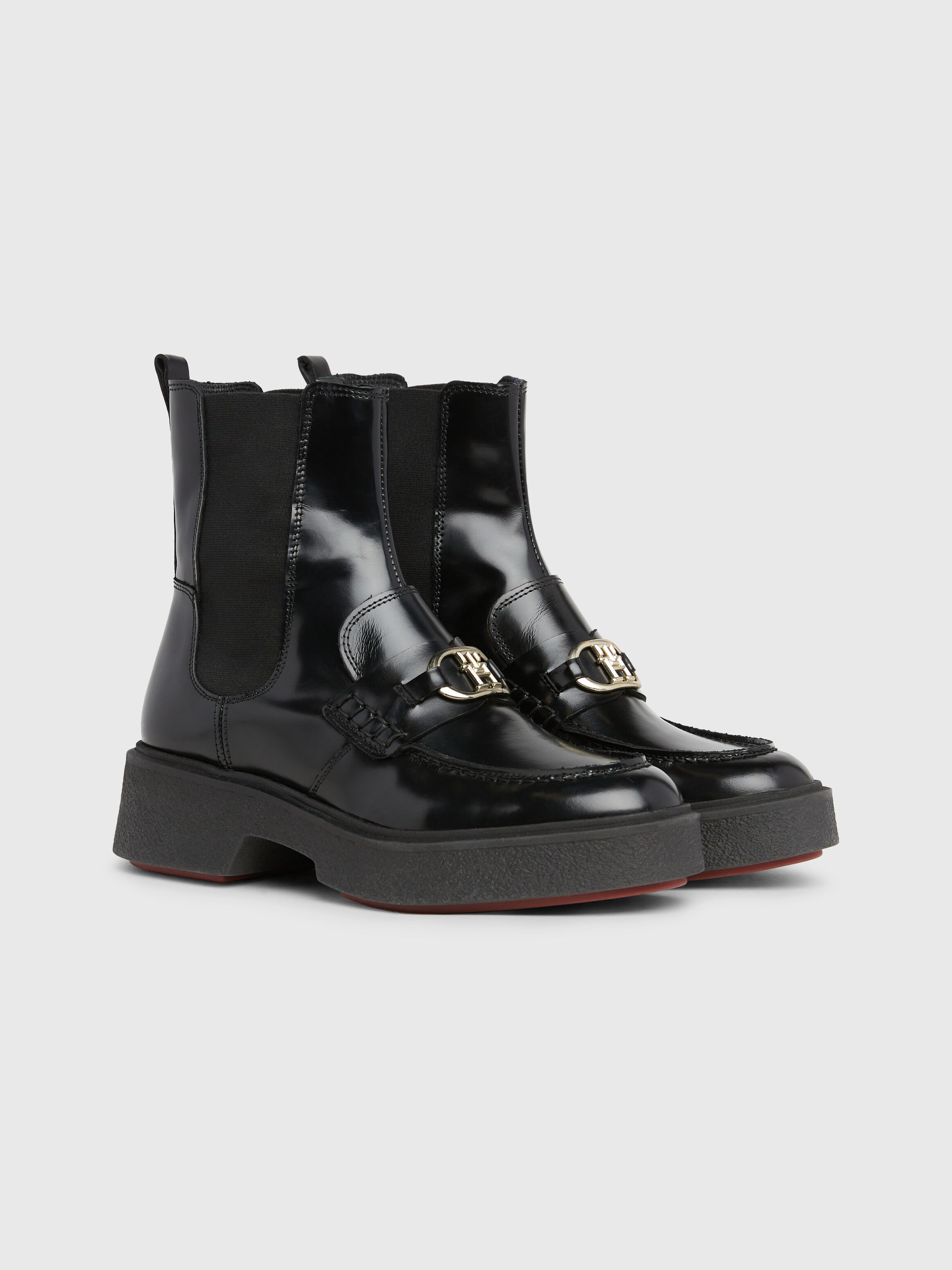 Tommy hilfiger monogram buckle best sale stretch boots